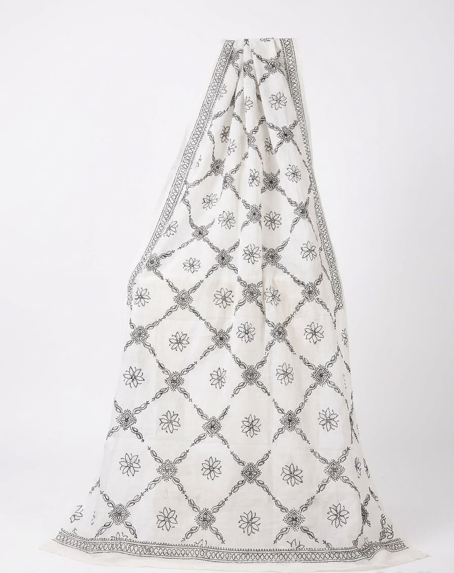 Full-length view of a white cotton dupatta featuring a delicate black embroidered floral lattice pattern and decorative border, displayed against a plain white background.