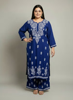 Navy Blue colour rayon fabric plus size kurti and trousers with white thread chikankari embroidery on the kurti and trousers.