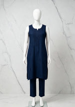 Full-length front view of the navy blue handcrafted sleeveless Chanderi silk Chikankari co-ord set displayed on a white mannequin against a marble background.