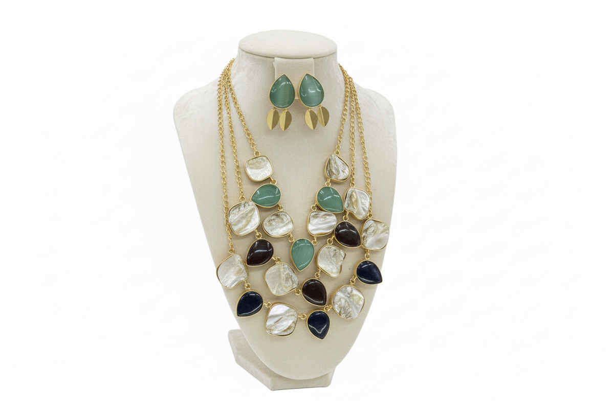 Necklace with multicolored stones on a black stand against a white background
