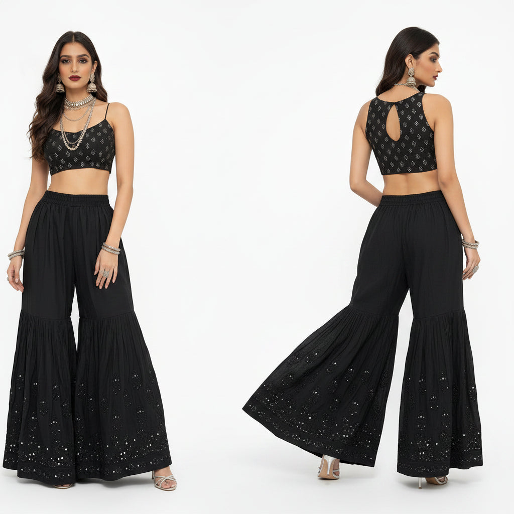 A composite studio shot displaying front, side, and back views of a model wearing a black flared gharara, featuring intricate Kaamdani work along the hem, paired with a matching embroidered crop top and traditional jewelry against a white background.