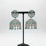 Ornate silver-toned jhumke featuring refreshing sea green marquise stones set against a brilliant white crystal framework.