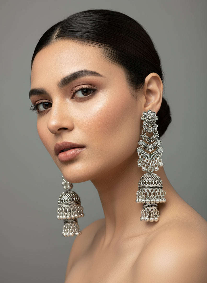 Model wearing silver oxidised tribal drop earrings