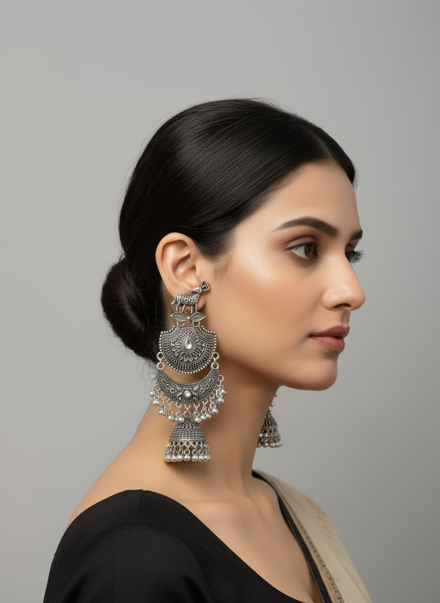 deer figure on the stud and chaand bali in drop with small jhumka Pair of silver oxidised earrings by famaza couture 
