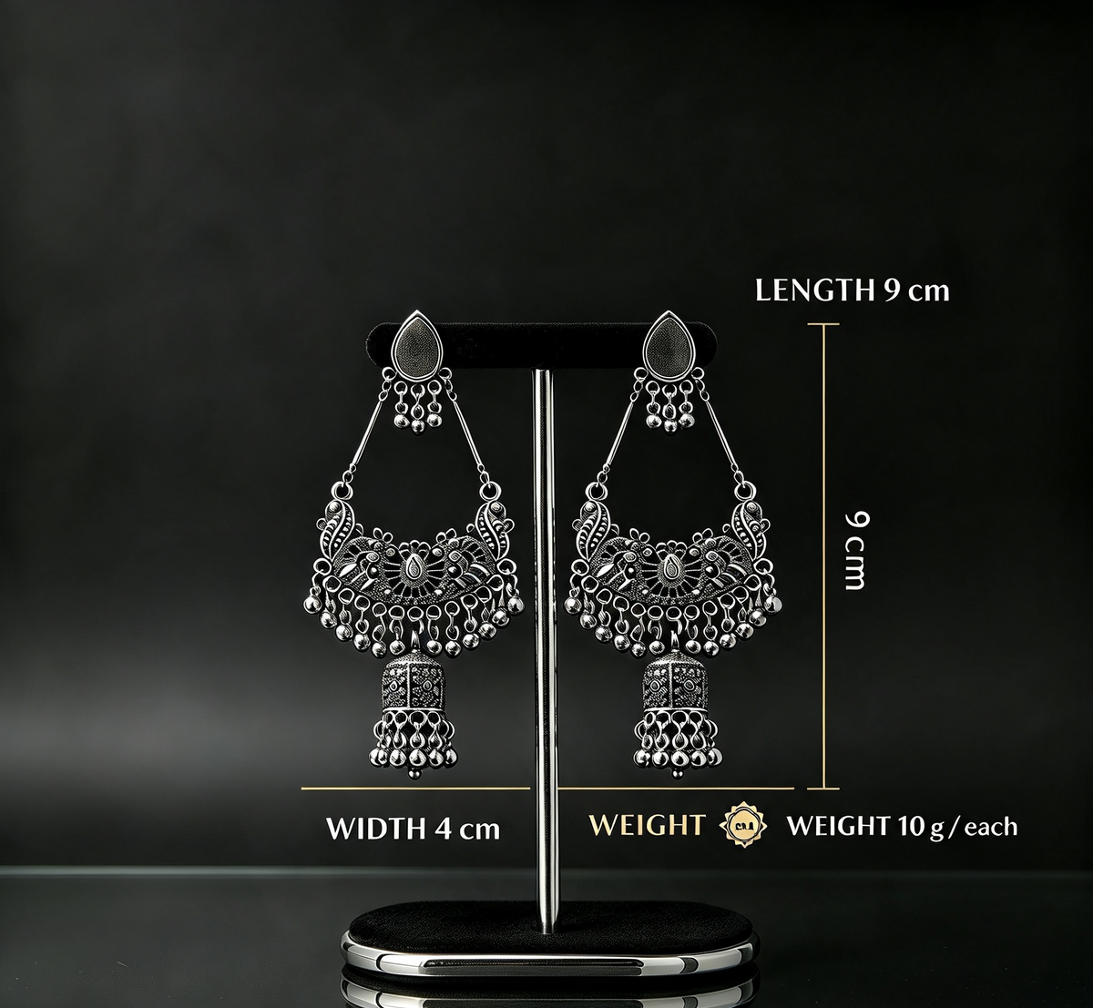 Oxidized silver chandbali jhumka earring on premium earring stand — length 9cm, width 4cm, 10 grams each — antique filigree peacock design with ghungroo drops.