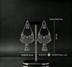 Oxidized silver chandbali jhumka earring on premium earring stand — length 9cm, width 4cm, 10 grams each — antique filigree peacock design with ghungroo drops.