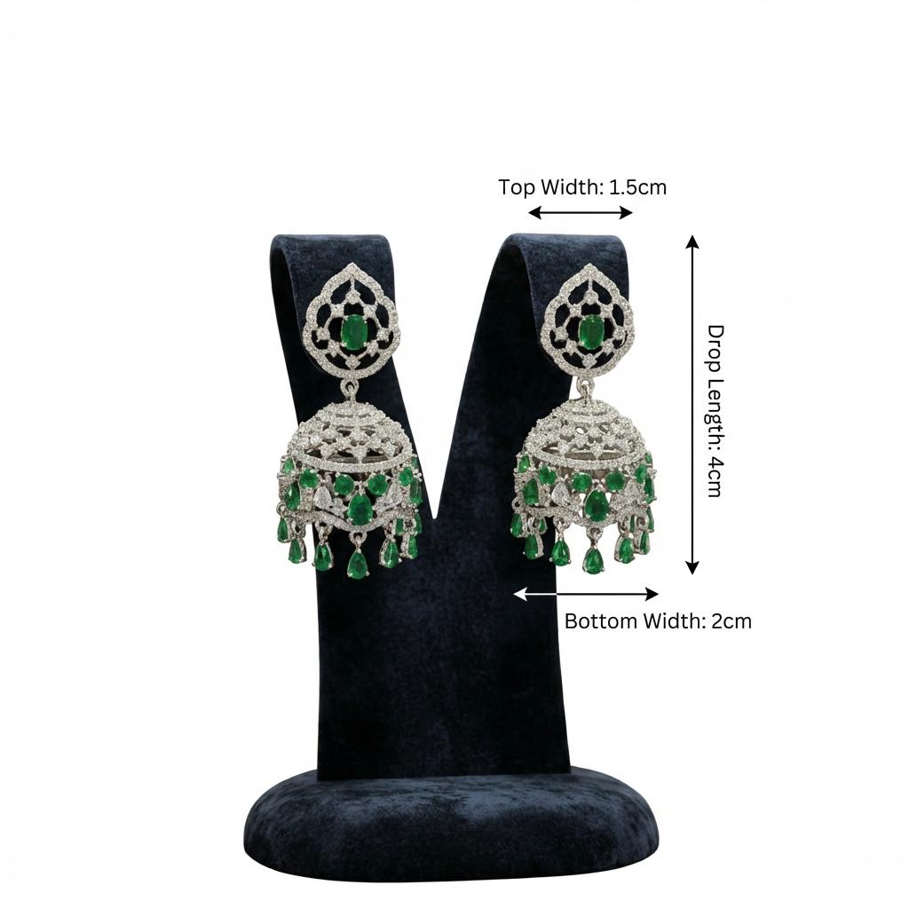 Pair of American diamond earrings with green gemstones.