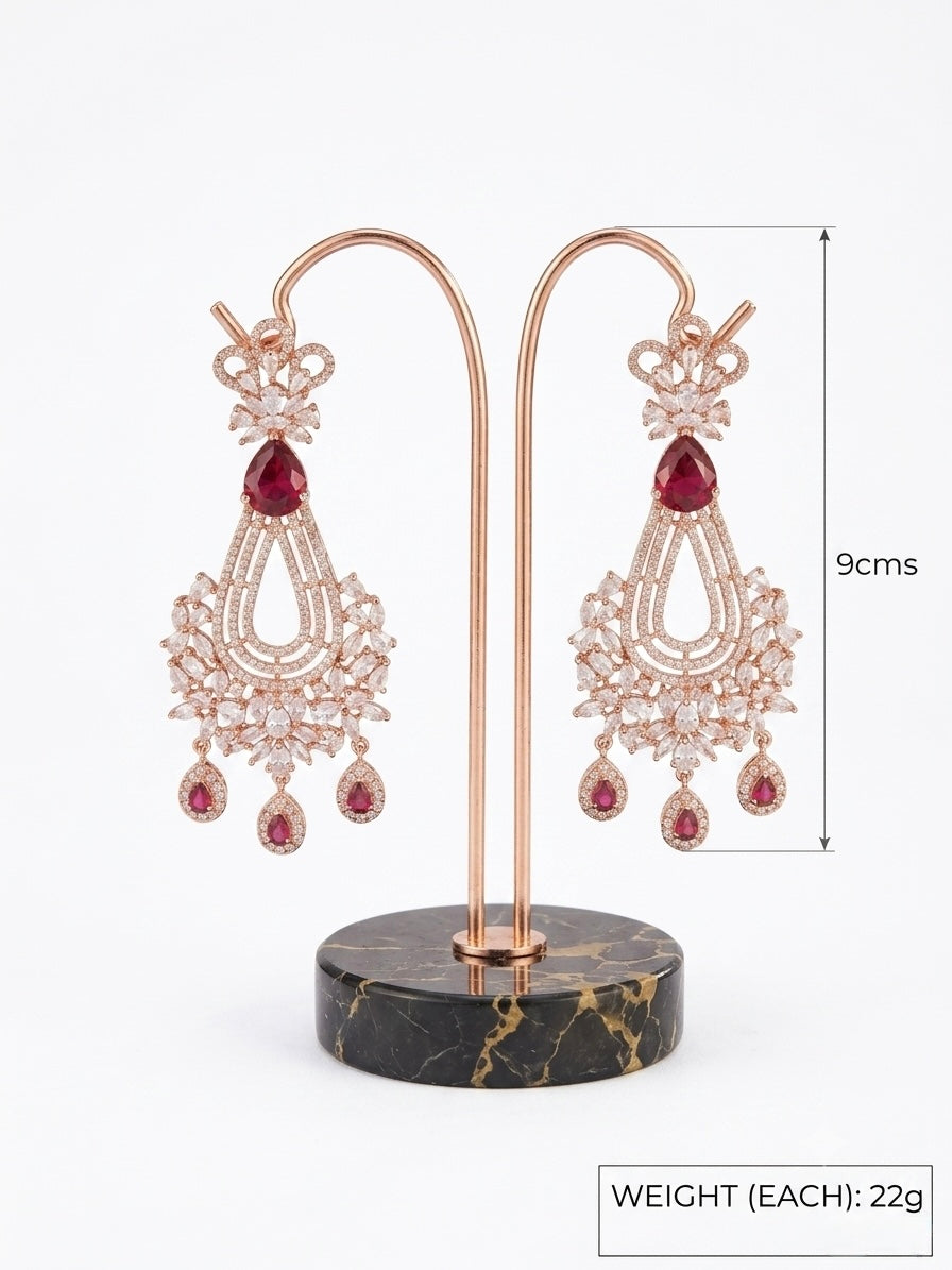 Pair of earrings on a stand with dimensions and weight information.