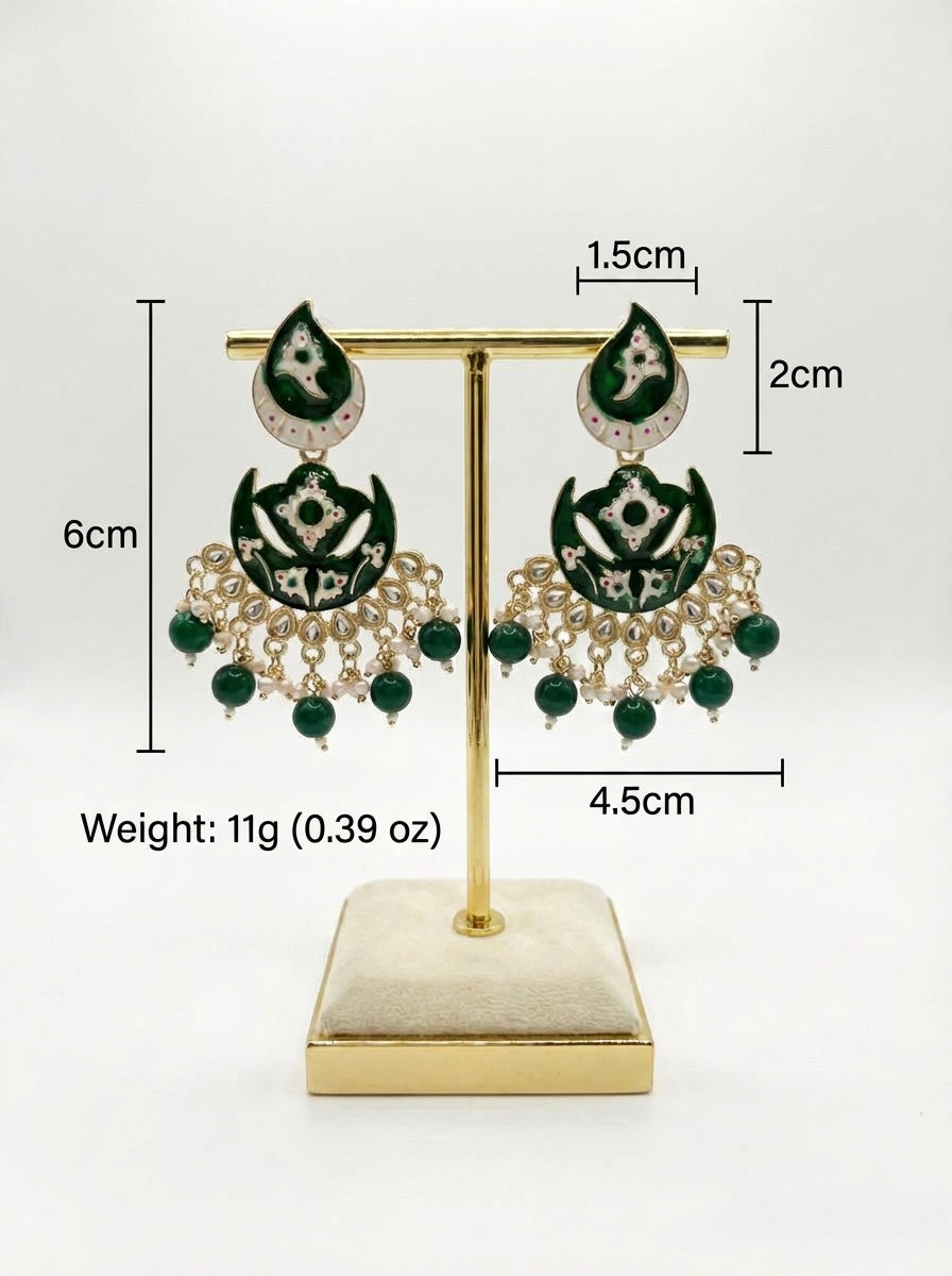 Pair of green and gold earrings on a gold stand with measurements and weight displayed.