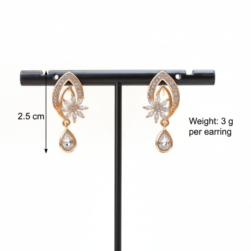 Pair of rose gold earrings on a stand with measurements and weight information.