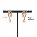 Pair of rose gold earrings on a stand with measurements and weight information.