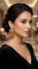 Pair of rose gold polished brass earrings featuring intricate circular filigree work, white Korean stones, and orange bead dangles.