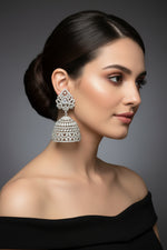Party wear earrings. Pair of silver American diamonds jhumka earrings. 