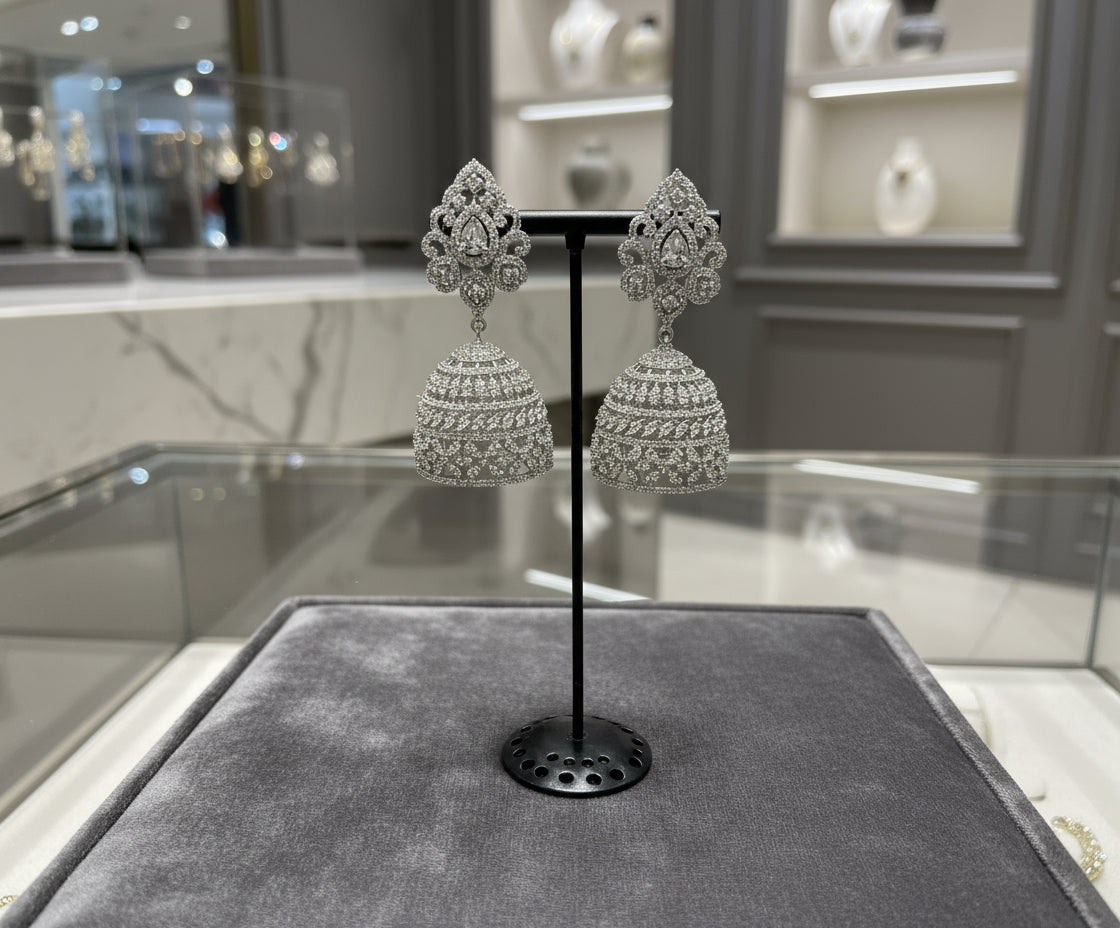 Party wear jhumka earrings. Pair of silver American diamonds jhumka earrings. 