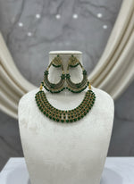 Party wear set. Green colour stones with golden plating chocker necklace and earrings in chand bali design. 