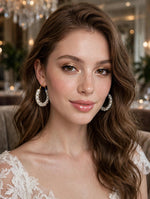 Pearl & clear crystal cluster hoop earrings, gold-tone lever-back, creamy white pearls with sparkling rhinestone accents — worn on model, bridal & party jewelry.