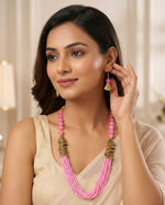 Pink mini beaded mala with gold accents and matching earrings by famaza couture .