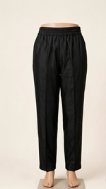 Front view of premium pure black silk trouser featuring elasticated waistband, smooth fine fabric, and tailored straight fit; designed to complement the kurta set, crafted for comfort and elegance, displayed on a mannequin against a soft neutral background.