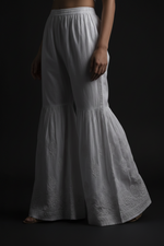 white cotton gharara with hand embroidery. 