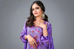 Pakistani embroidered suit set with close-up of floral embroidery details
