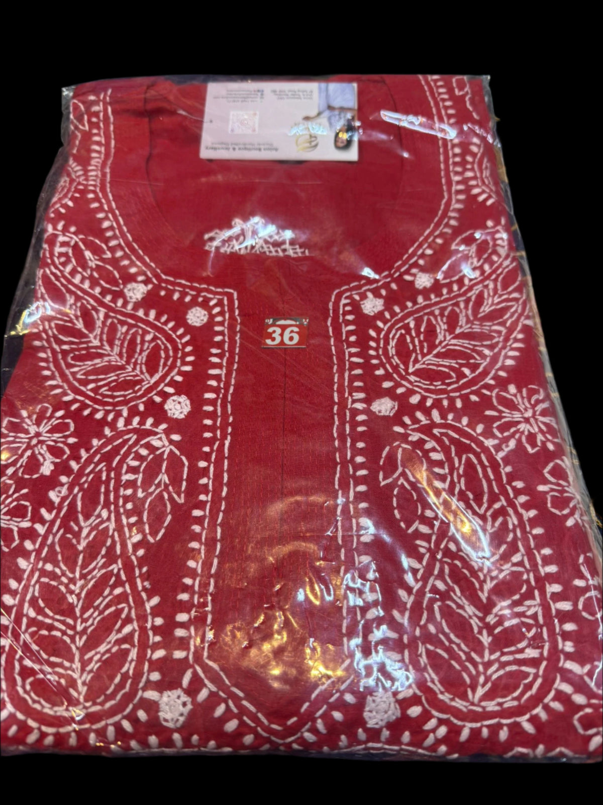 Red chikankari kurti neck close up 