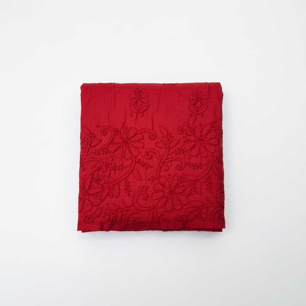 Red cotton plazo is folded and the Bakhiya embroidery is focused