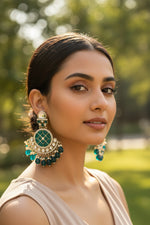 Rich bottle green Chandbalis showcasing a mosaic center and vibrant green crystal droplets.