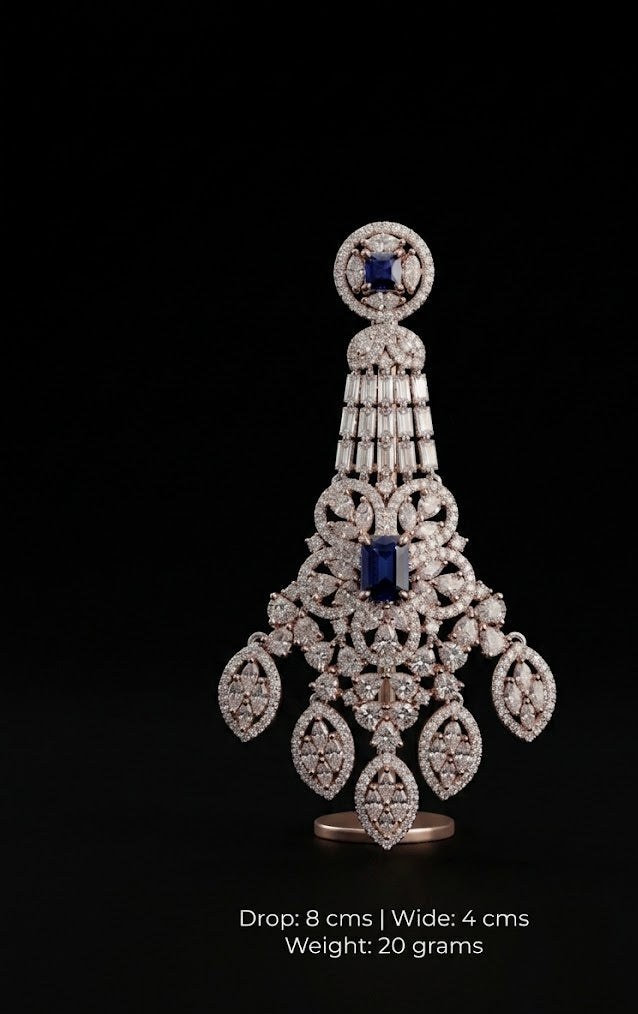 Rose gold chandelier earring with blue sapphires and diamonds.