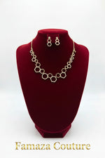 Rose Gold geometric link necklace and matching drop earrings displayed on a black velvet jewellery bust against a white background.