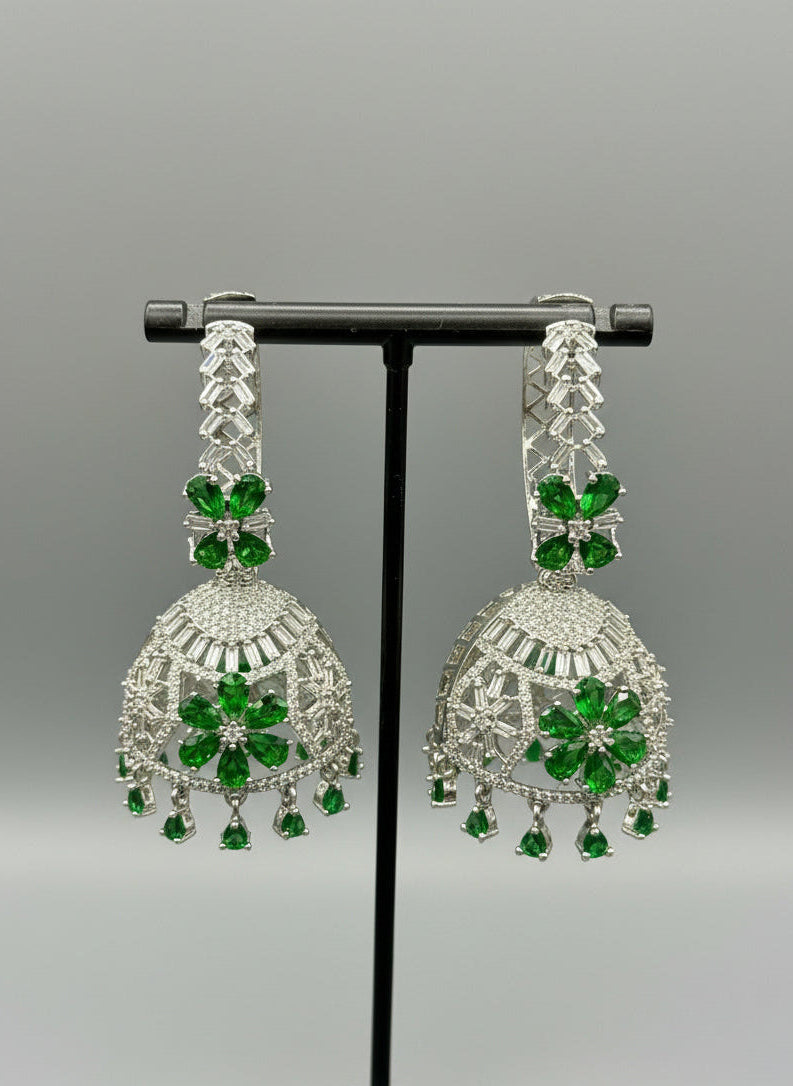 Round bali on top and jhumka in the bottom style earrings with silver AD stones and bottle green stones in flowers. Party wear earrings. 