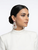 Side profile of a model showcasing luxury bridal chandelier earrings featuring a sunburst crystal design accented with focal crimson ruby drops.