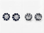 A pair of floral stud earrings shown from both front and back views on a white background. The front view shows a silver-toned center stone surrounded by dark blue gemstone petals, while the back view shows the silver-toned setting with dark blue gemstone accents.
