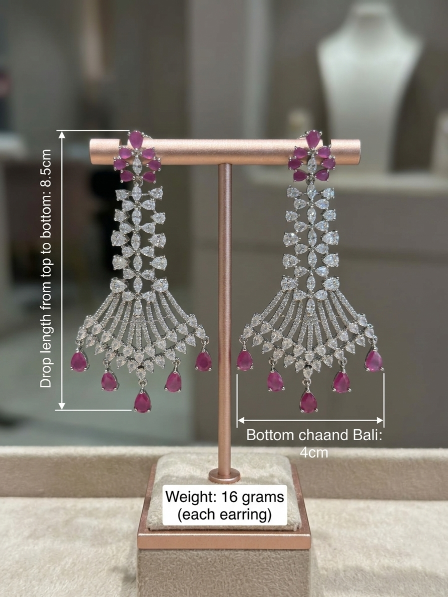 Pair of earrings on a stand with measurements and details.