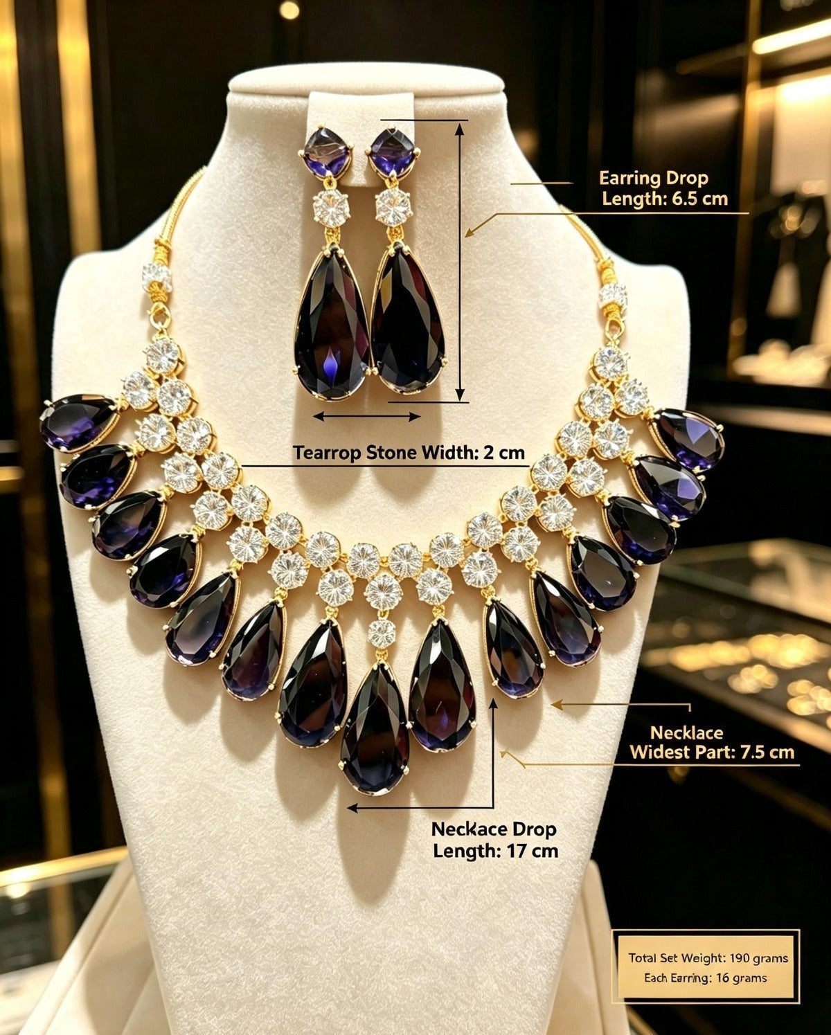 Sapphire blue teardrop statement jewelry set with full specifications, deep navy blue pear gemstones and brilliant CZ, dimension guide and weight details, premium jewelry for weddings and special occasions.
