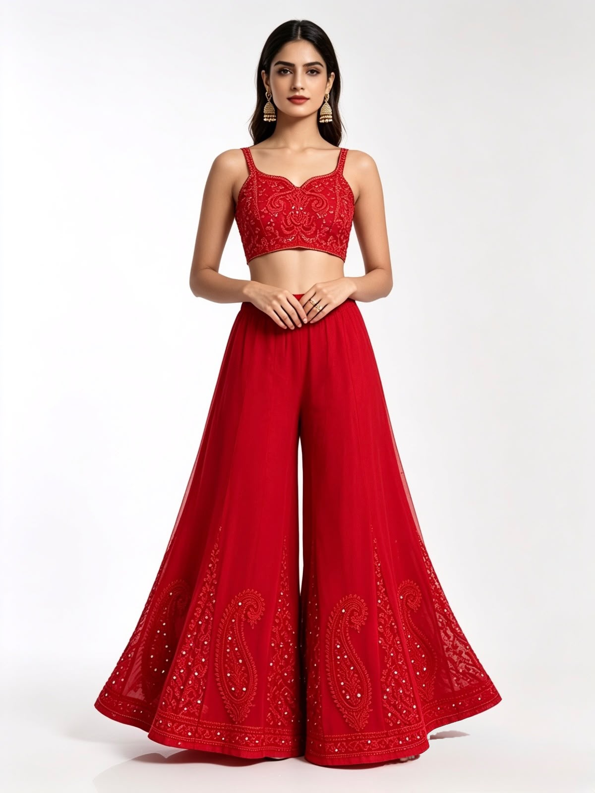 Front view of a vibrant scarlet wide-leg sharara, featuring intricate red paisley embroidery and delicate white beadwork along the hem, set against a pure white background.
