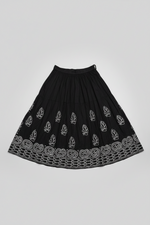 The Sharara with white thread bakhiya embroidery is shown as folded in double layer. Focus is embroidery.