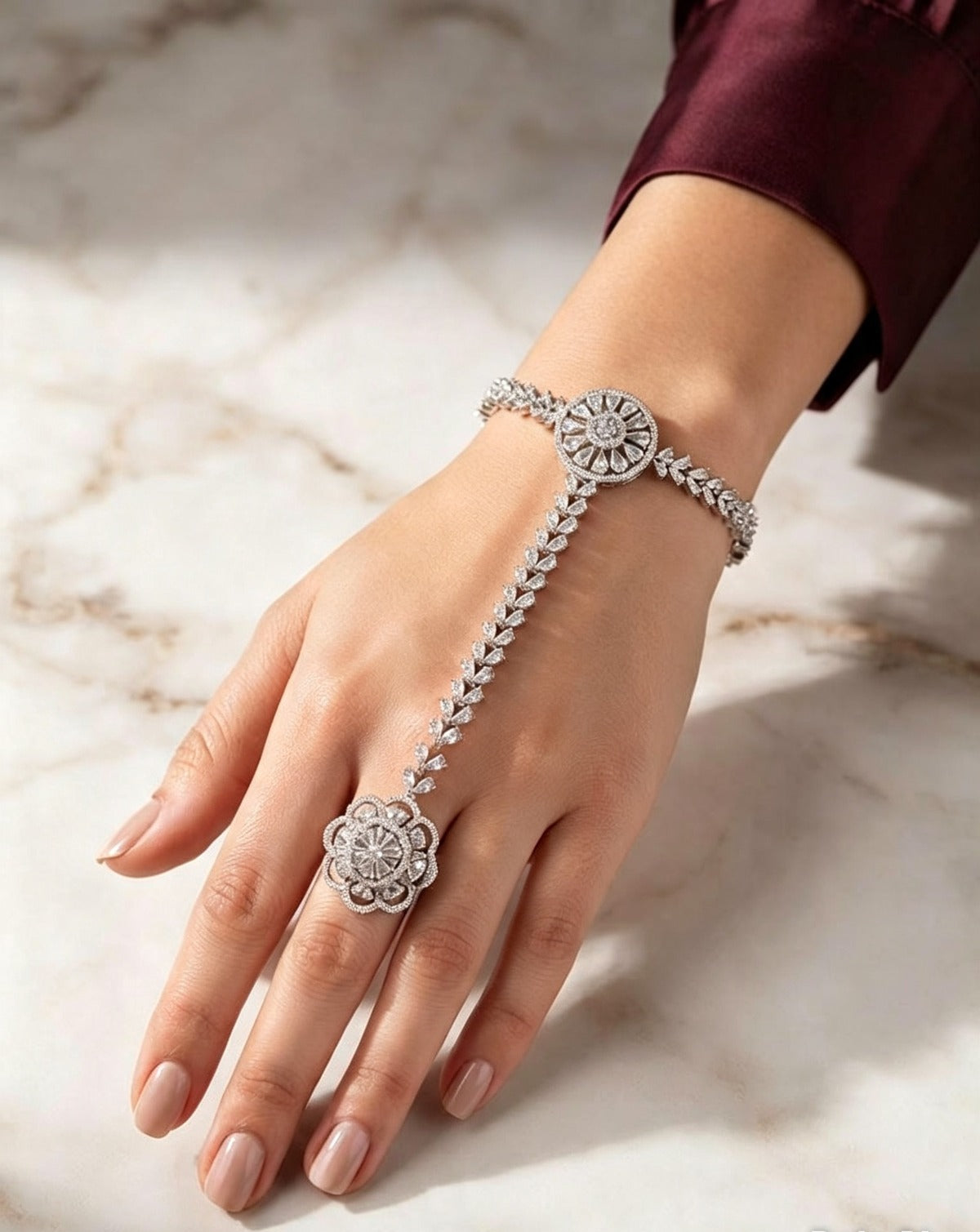 Silver plated floral AD stone hathphool hand harness — connected bracelet to ring hand chain with sparkling clear cubic zirconia stones, Pakistani bridal festive jewelry, worn on hand.