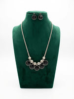 Silver chained with black kundan stones A long necklace and matching stud earrings . 