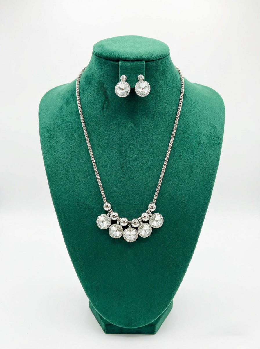 Silver chained with kundan stones long necklace and matching stud earrings . 