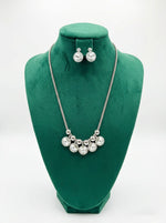 Silver chained with kundan stones long necklace and matching stud earrings . 