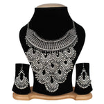 Silver necklace and earrings set on a black mannequin bust with a white background