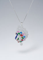 Silver polished a peacock pendant with vibrant green, blue, red and pink enamel accents, along with white AD stones sparkling embellishments. Pendant is focused to show the design.