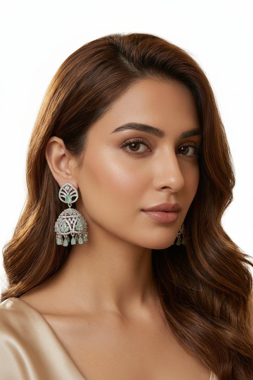 Soft ice blue bridal Jhumka earrings with high-shine crystal worn by our model.