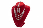 The AD triple layer cubic zirconia necklace, earrings and maang tikka
