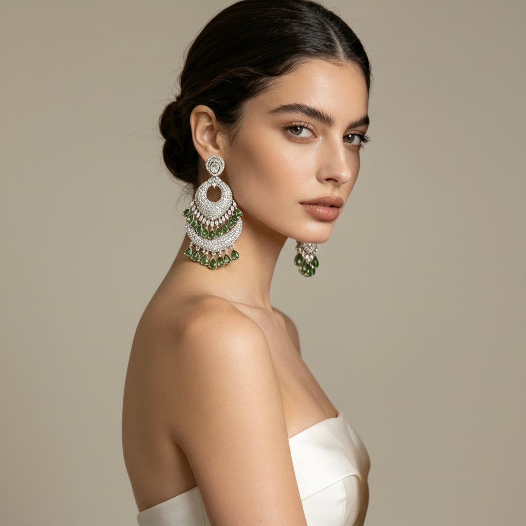 The American diamond earrings with bottle green stones.
