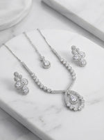  The American diamonds bridal jewellery set including necklace, earrings and maang tikka.