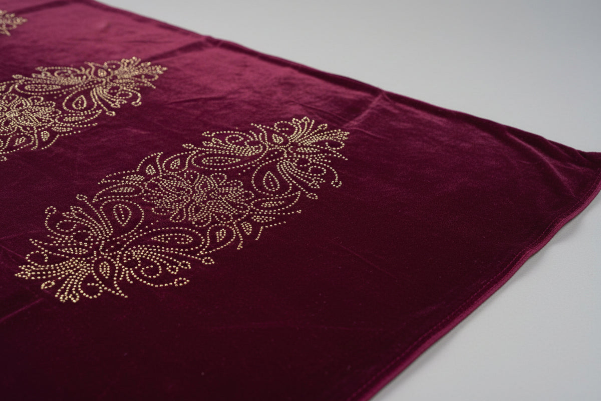 The Maroon colour velvet fabric shawl with gold colour nano beads embellishments and intricate floral patterns.