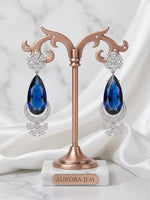 Traditional Chaand Bali earrings with ruby red stones and pearl drops.