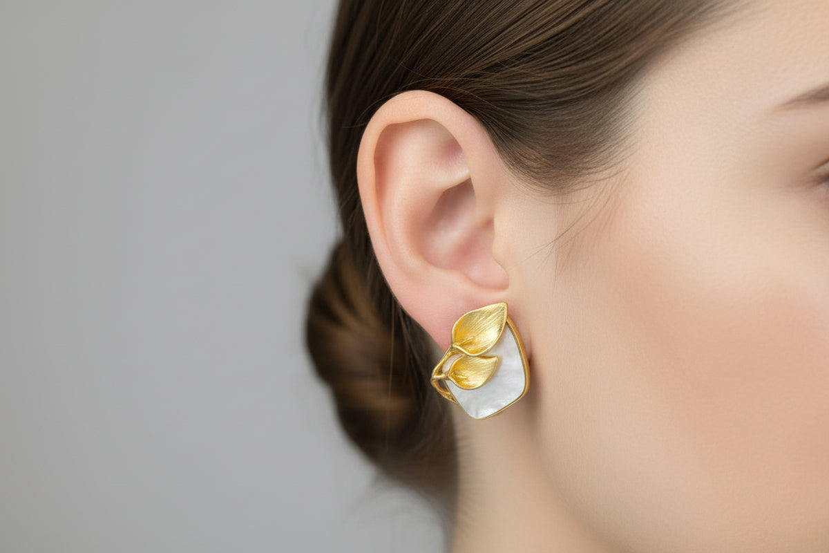 Gold plated mother of pearl petal flower stud earrings by Famaza Couture