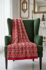 The Red floral-patterned shawl with Famaza Couture' branding.